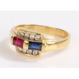 Diamond sapphire and ruby ring, the head set with an emerald cut sapphire and ruby flanked by