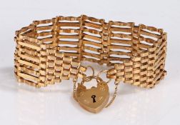 9 carat gold gate-link bracelet, with padlock clasp and security chain, 18.8 grams