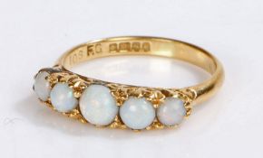 18 carat gold and opal set ring, with five cabochon cut opals to the head, 2.8 grams, ring size L