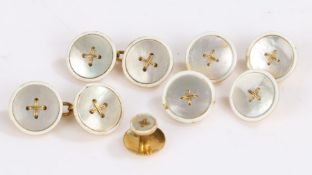 Pair of 18 carat gold backed mother of pearl button effect cufflinks, four matching dress buttons