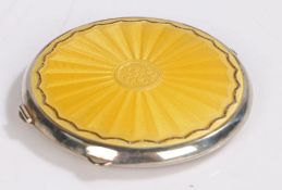White metal and yellow enamel decorated powder compact, maker Joseph Gloster Ltd. of circular form