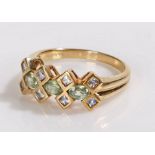 9 carat gold ring, set with pale green and violet set stones, 3 grams, ring size M