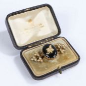 Victorian pearl and agate brooch, the central oval penal with a pearl set leaf flanked either side