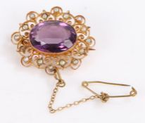 Victorian yellow metal pearl and amethyst brooch, the central amethyst surrounded by pearls in a