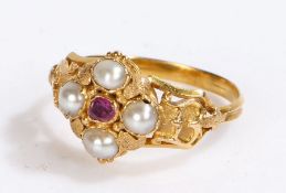 19th Century pearl and ruby set ring, the head in the form of a flower head with shaped shoulders,