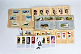 Cigarette and tea card albums, to include Wills's International Airliners, the sea shore, film stars