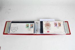 Royalty FDC's and GB, housed in a red album