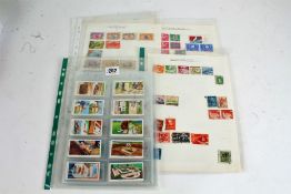 Assorted world stamps, box of album pages, packets etc.