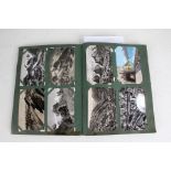 Postcards, mainly topographical, in four albums (4)