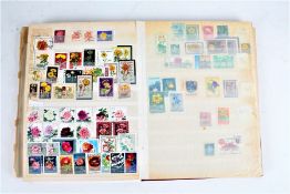 Flower stamps, M + U, housed in five albums and stockbooks (5)