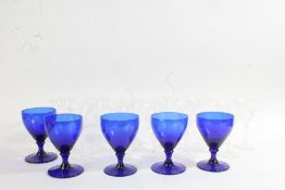 Set of five Bristol blue style rummers, together with eleven clear flared champagne glasses (qty)