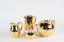 Royal Worcester gilt tea set, consisting of teapot, hot water jug, milk jug and sugar bowl (4)