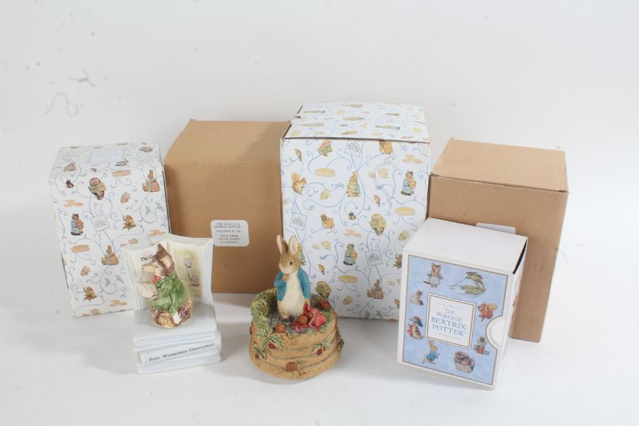 Four Beatrix Potter Peter Rabbit musical boxes, two in original boxes, and two Border Fine Arts