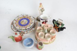 Decorative porcelain, to include egg cup stand, two German porcelain wall plates, boxed pair of