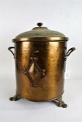 Art Deco spot hammered brass coal bin, having lift up lid, the body with a diamond shaped motif,