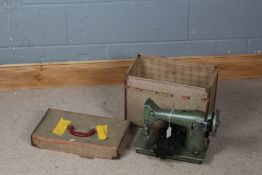 Jones electric sewing machine, in green with carrying case (sold as collectors item)