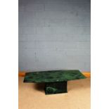 20th century green marble table, the bow sided top raised on a rectangular plinth base, 141cm long