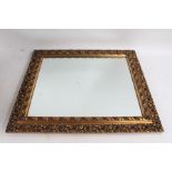 20th century ornate gilt framed wall mirror, with pierced border, 52cm wide x 60cm high