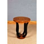 Art Deco style side table, having circular inlaid top raised on four ebonised shaped legs and