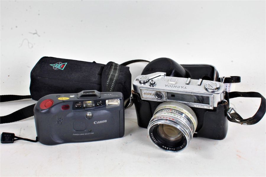 Yashica Lynx-14 camera, with leather case, and a Canon Sure Shot Ace camera (2)