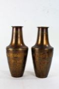 Pair of Art Nouveau British made brass vases, each of baluster form with floral roundels, 30cm