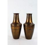Pair of Art Nouveau British made brass vases, each of baluster form with floral roundels, 30cm
