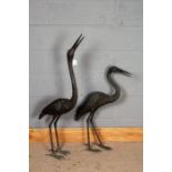 Pair of cast metal garden cranes, the tallest 113cm (2)