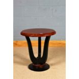 Art Deco style side table, having walnut effect circular top raised on ebonised shaped legs and