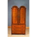 Butilux "Beauty Craftsmanship" mid 20th Century double dome top wardrobe, the arched doors opening