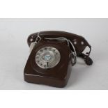 Brown plastic rotary dial telephone, 24cm wide