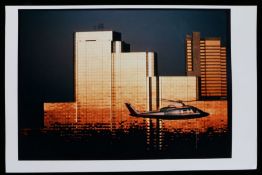 "Helicopter Near Skyscraper", a photograph depicting a helicopter passing in front of a group of