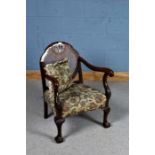 1920's/30's bergere armchair, having cane back rest and open scrolling arms, raised on claw on