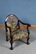 1920's/30's bergere armchair, having cane back rest and open scrolling arms, raised on claw on