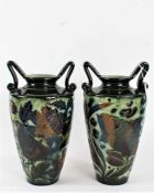 Two Lauder Barum pottery twin handled vases, the tapering bodies with bird and fish decoration, 29.