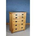 Modern light oak chest of four short and three long drawers, 98cm wide