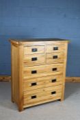 Modern light oak chest of four short and three long drawers, 98cm wide