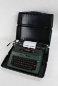 Silver Reed 500 typewriter, in green, with carrying case