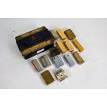 Collection of various lighters and a commemorative tin containing medals, pens etc. (qty)