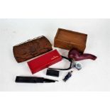 Mixed works of art, to include a snakeskin clutch bag, red leather pipe case, cut throat razor, bone