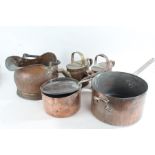 Large copper and iron handled saucepan with lid, together with another smaller, a copper frying pan,