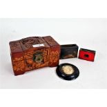 Chinese miniature carved camphorwood jewellery box, with original retail card to the interior,