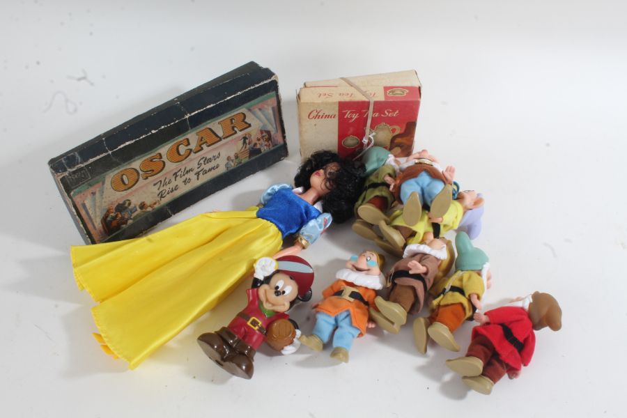 Collection of Disney figures, to include a doll dressed as Snow White and seven dwarfs, another of