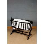 Victorian style wooden crib, having bobbin turned spindles and raised on stand, 118cm wide