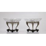 Pair of silver plated and cut glass table centre pieces, the associated cut glass bowls above a vine