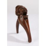 19th Century treen nutcracker, carved as a bearded man with a pointed hat, 20cm high