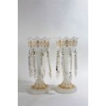 Pair of Victorian opaque glass table lustres, with gilt overlaid decoration and faceted prism drops,