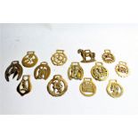 Collection of horse brasses, to include examples on leather straps (32)