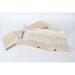 Two handwritten indentures on vellum, the first dated 1666, the reverse bearing signatures, 67cm