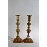 Pair of Victorian brass candlesticks, the stemmed body with turned affect, 27cm tall