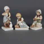 Drei Kinderfiguren - Goebel, Keramik, polychrom gefasst, 1x Kind mit Hase und B